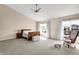 Bright main bedroom featuring vaulted ceilings, neutral carpet, and large windows at 1074 Reserve Way, Indianapolis, IN 46220