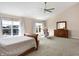 Spacious main bedroom with a vaulted ceiling, neutral carpet, and windows overlooking the exterior at 1074 Reserve Way, Indianapolis, IN 46220
