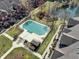 Aerial view of the community pool with shaded area near condo buildings at 1074 Reserve Way, Indianapolis, IN 46220