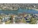 Aerial view of lakeside property outlined in red with mature trees and surrounding neighborhood at 10817 Lakeview Dr, Carmel, IN 46033