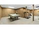 Finished basement with a pool table and exercise equipment at 10817 Lakeview Dr, Carmel, IN 46033