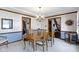 Elegant dining room featuring hardwood floors, a chandelier, and plenty of natural light at 10817 Lakeview Dr, Carmel, IN 46033