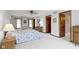 Spacious main bedroom featuring an ensuite bathroom and multiple windows with seating at 10817 Lakeview Dr, Carmel, IN 46033