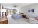 Relaxing main bedroom with balcony access, neutral decor, and ceiling fan at 10817 Lakeview Dr, Carmel, IN 46033
