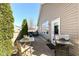 Cozy backyard patio with a dining table, seating area, and grill, ideal for outdoor entertaining at 1120 Oak Hill Ln, Cicero, IN 46034