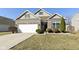 Charming single-Gathering home with a well-manicured front yard and two car garage at 1120 Oak Hill Ln, Cicero, IN 46034