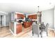 Modern kitchen with wood cabinets, stainless steel appliances, and a center island at 1120 Oak Hill Ln, Cicero, IN 46034