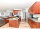 Modern kitchen with stainless steel appliances and wood cabinets at 1120 Oak Hill Ln, Cicero, IN 46034