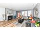 Spacious living room with hardwood floors, fireplace, and plenty of natural light at 1120 Oak Hill Ln, Cicero, IN 46034