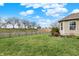 Backyard features lush grass and a decorative fence creating a serene outdoor space for enjoyment and relaxation at 129 W Clear Lake Ln, Westfield, IN 46074