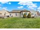 Well-maintained backyard featuring healthy green grass and simple landscaping for relaxation and outdoor enjoyment at 129 W Clear Lake Ln, Westfield, IN 46074