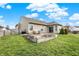 Spacious backyard with a small patio area perfect for outdoor dining and entertaining or enjoying the sunshine at 129 W Clear Lake Ln, Westfield, IN 46074
