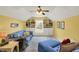 Bright bonus room with built-in shelving, soft lighting, and comfortable seating areas at 129 W Clear Lake Ln, Westfield, IN 46074