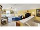 Spacious bonus room with ample lighting, built-in shelves, and cozy furniture at 129 W Clear Lake Ln, Westfield, IN 46074
