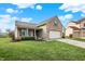 Inviting single-Gathering home with green lawn and tasteful landscaping at 129 W Clear Lake Ln, Westfield, IN 46074