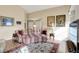 Bright living room showcasing a plaid sofa, area rug, and hardwood floors at 129 W Clear Lake Ln, Westfield, IN 46074