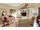 Cozy living room with vaulted ceilings, built-in shelving, and abundant natural light at 129 W Clear Lake Ln, Westfield, IN 46074