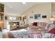Open-concept living area with hardwood floors, comfortable seating, and access to the kitchen at 129 W Clear Lake Ln, Westfield, IN 46074