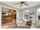 Open sunroom offering hardwood floors and views into the eat-in kitchen with natural light at 129 W Clear Lake Ln, Westfield, IN 46074