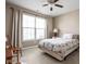 Bedroom featuring a neutral color scheme, carpet, a ceiling fan, and a large window with natural light at 1382 Redstone Dr, Avon, IN 46123