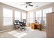 Bright bedroom with ample natural light, neutral carpet, and an office setup with desk and storage at 1382 Redstone Dr, Avon, IN 46123