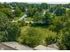 Aerial shot of a home with a view of the roof and surrounding greenery, offering a glimpse of its private and peaceful setting at 1409 S Harmony Trl, Greenfield, IN 46140
