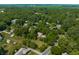 Scenic aerial perspective of homes enveloped by dense trees, creating a private and secluded residential atmosphere at 1409 S Harmony Trl, Greenfield, IN 46140
