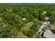 Lush green space surrounds homes in this aerial view, creating a tranquil neighborhood perfect for nature lovers at 1409 S Harmony Trl, Greenfield, IN 46140
