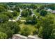 Aerial view of a residential neighborhood with tree-lined streets and well-maintained lawns at 1409 S Harmony Trl, Greenfield, IN 46140