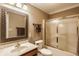 Bathroom featuring a vanity, toilet, and tiled shower with glass doors at 1409 S Harmony Trl, Greenfield, IN 46140