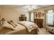 Comfortable bedroom with a queen bed, coordinated furniture and natural light at 1409 S Harmony Trl, Greenfield, IN 46140