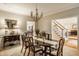 Bright dining room offers abundant natural light and views of other living spaces, enhancing the home's open layout at 1409 S Harmony Trl, Greenfield, IN 46140