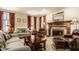 Comfortable living room featuring a fireplace, plush seating, and elegant decor at 1409 S Harmony Trl, Greenfield, IN 46140