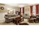 Comfortable living room featuring a fireplace, plush seating, and elegant decor at 1409 S Harmony Trl, Greenfield, IN 46140