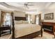 Spacious main bedroom with a tray ceiling, fireplace, and ensuite bathroom offers a luxurious retreat at 1409 S Harmony Trl, Greenfield, IN 46140