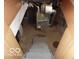 View of gray stairs leading to a cement floor basement with a heater at 1507 Hannibal St, Noblesville, IN 46060