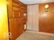 Neutral bedroom features wood paneled walls and built in storage, offering practicality and a cozy feel at 1507 Hannibal St, Noblesville, IN 46060