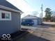 Detached garage with a blue SUV parked in the driveway at 1507 Hannibal St, Noblesville, IN 46060