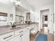 Well-lit bathroom with double sinks, granite countertops, and modern fixtures at 15104 Midland Ln, Noblesville, IN 46062