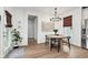 Well-lit dining area with a modern chandelier and stylish decor at 15104 Midland Ln, Noblesville, IN 46062