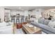 Inviting living area flowing into a kitchen, featuring a comfortable seating arrangement, chic decor, and a functional layout at 15104 Midland Ln, Noblesville, IN 46062