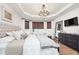 Luxurious main bedroom featuring a tray ceiling and large windows at 15104 Midland Ln, Noblesville, IN 46062