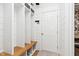 Convenient mudroom with built-in storage, a bench, hooks, and white shiplap walls at 15104 Midland Ln, Noblesville, IN 46062