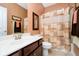 Bathroom with vanity, toilet and shower featuring modern fixtures and decorative accents at 15506 Slateford Rd, Noblesville, IN 46062