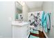 Bathroom featuring vanity with marble countertop, decorative mirror, and coordinated fixtures at 15506 Slateford Rd, Noblesville, IN 46062