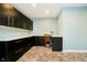 Dedicated craft room with ample cabinet space, countertop workspace, and decorative flooring at 15506 Slateford Rd, Noblesville, IN 46062