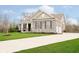 Charming home featuring a stone facade, well-manicured lawn, and a spacious driveway, creating curb appeal at 15506 Slateford Rd, Noblesville, IN 46062