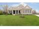 Charming stone home with a manicured lawn and covered front porch offers curb appeal at 15506 Slateford Rd, Noblesville, IN 46062
