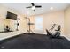 Home gym featuring an exercise bike, pull up station, and a full length mirror at 15506 Slateford Rd, Noblesville, IN 46062