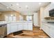 The kitchen features white cabinets, granite countertops, stainless steel appliances, and wood-style flooring at 15506 Slateford Rd, Noblesville, IN 46062